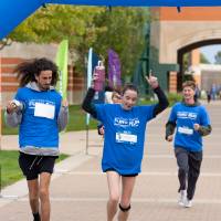 Participants crossing finish line celebrating